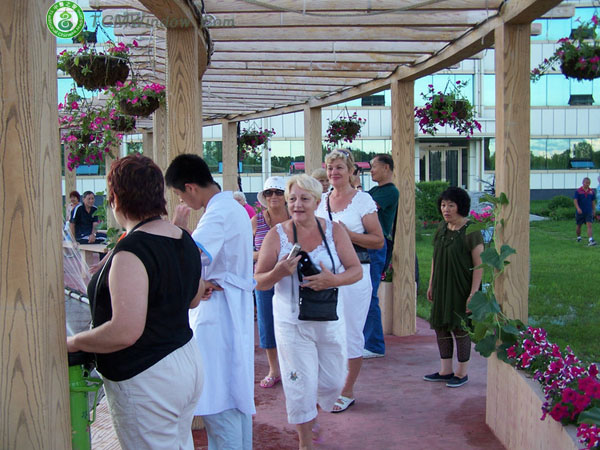 visitors are looking around our herbal garden. they are so curious at everything and seem to have a 