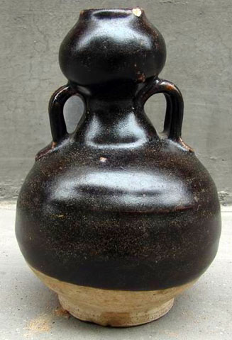 black glazed bottle in the shape of a calabash